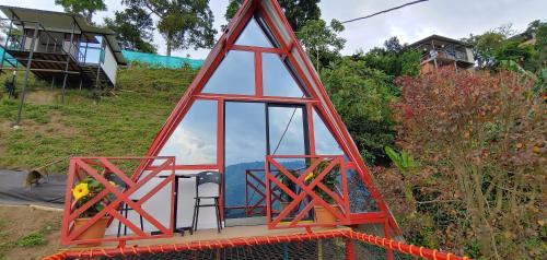 a structure that looks like a tower with a room at Finca buenos aires in Manizales