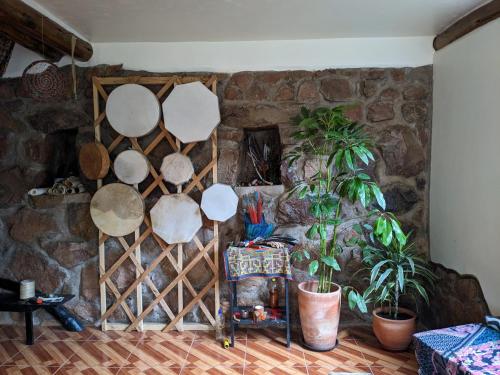 a room with a wall with a bunch of mirrors at Elegua Casa Medicina in Pisac