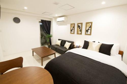 Llit o llits en una habitació de プロスパービル 2B