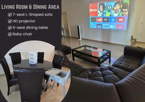 a living room with a couch and a table at Homestay Medina Sendayan in Kampong Baharu Jimah