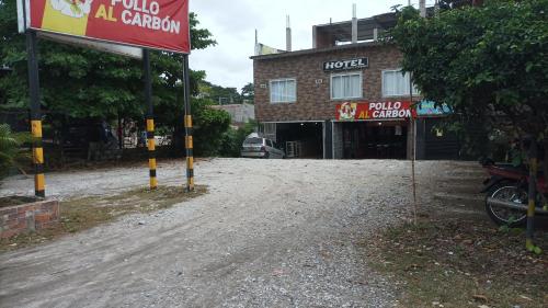 a sign in front of a building at LA PLAZOLETA in Doradal