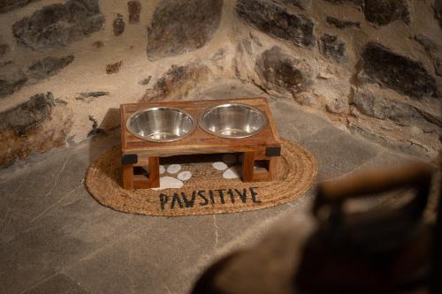 a serving tray with two bowls on a table at Byzantine Home in the Castle in Mesta