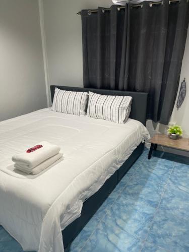 Ένα ή περισσότερα κρεβάτια σε δωμάτιο στο S & K surin