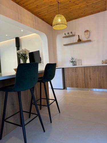 a dining room with a table and two chairs at Pirella House in Limassol