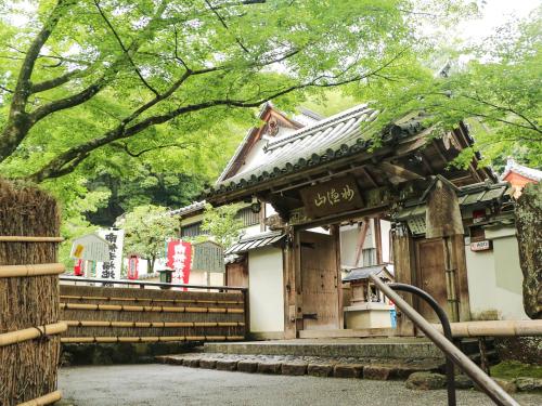 a building with a gate and stairs in front of it at REF Kyoto Hachijoguchi by VESSEL HOTELS in Kyoto