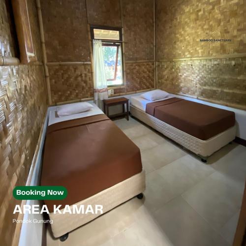 a bedroom with two beds in a room at Bamboo Sanctuary Pancawati Resort Bogor in Ciherangsating