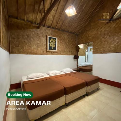 a bedroom with a bed in a room at Bamboo Sanctuary Pancawati Resort Bogor in Ciherangsating