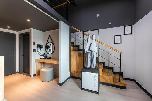 a room with a baseball dugout and a stair case at Hotel Yaja Terminal Branch in Jeonju