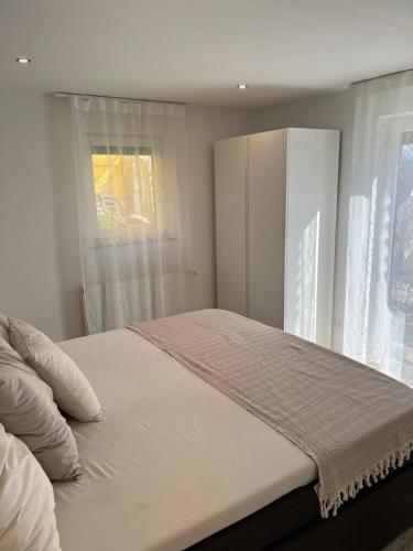 Una cama o camas en una habitación de 1-Zimmer Apartment in Altbach