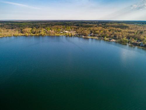 an aerial view of a large body of water at 3BR Fife Lake Getaway with Fire Pit & Hot Tub in Fife Lake