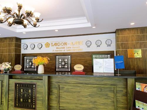 a reception desk in a building with a chandelier at Saigon-Ba Be Resort in Ba Be