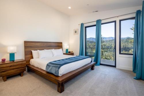 a bedroom with a bed and a large window at Suncadia 7 Bdrm Home with Amazing View and a Hot Tub in Cle Elum
