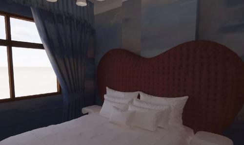 Llit o llits en una habitació de Kitsch Hotel