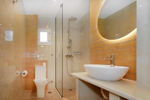 a bathroom with a sink and a shower at Agapitos Apartments in Nikiti