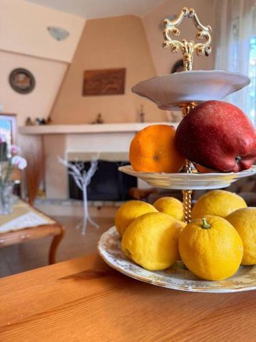a display of fruit on a plate on a table at Family Woodland Oasis VIPGreece in Kírinthos
