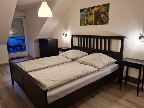 a bedroom with a large bed in a room at Ferienhaus Am Reilsbach in Cochem