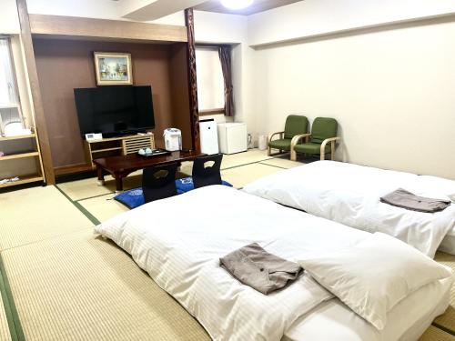 Katil atau katil-katil dalam bilik di Hotel Tokeidai