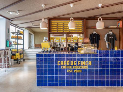 a store with a blue tiled counter in a room at Zel Mallorca in Palmanova