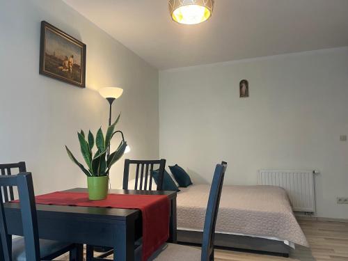 Posteľ alebo postele v izbe v ubytovaní Apartament Łagiewniki Krakow