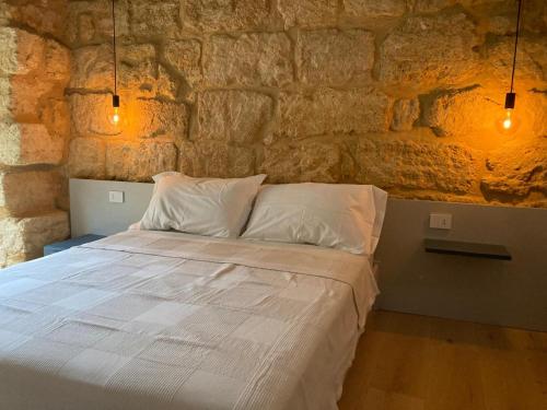 Postel nebo postele na pokoji v ubytování Atenea45 suites