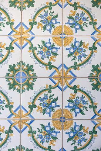 a tiled floor with a pattern of flowers at Apartment Stella Maris in Capri