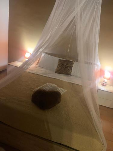 Postel nebo postele na pokoji v ubytování La soffitta di Megan