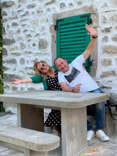 a man and a woman laying on a bench at Villa B&B Marina & Parking Free in Rovinj