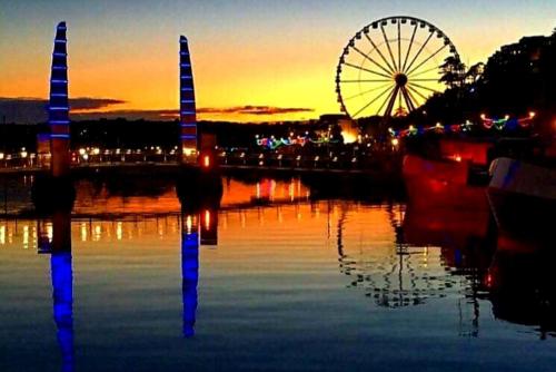 a ferris wheel and a ferris wheel at sunset at Yardley Manor Hotel in Torquay