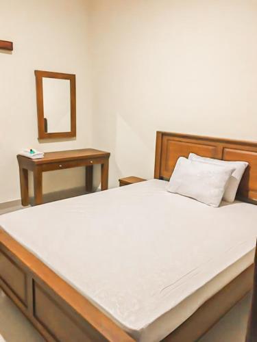Ένα ή περισσότερα κρεβάτια σε δωμάτιο στο Pondok Puvi-Puvi