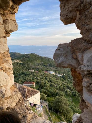 a view from a window in a rock at GKOROS HOUSE OLD TOWN in Himare