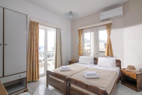 Posteľ alebo postele v izbe v ubytovaní Litsa Mare Apartments