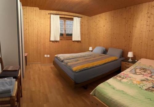 Ліжко або ліжка в номері Cama Mesolcina appartamento P.T.