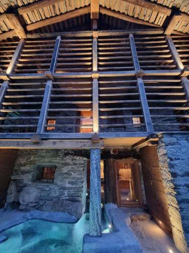 an overhead view of a building with a pool of water at Ad Maiora Baita Walser with SPA in Alagna Valsesia