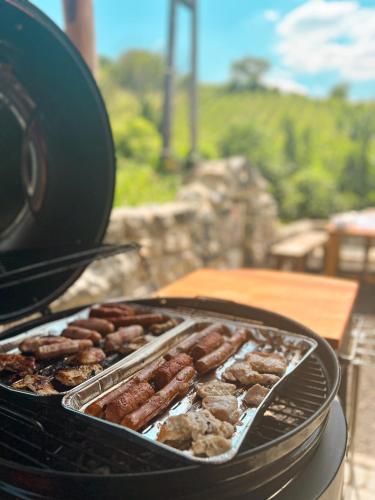 a bunch of donuts are cooking on a grill at Somló Nordic in Somlószőlős