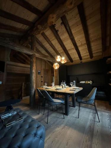 a large dining room with a table and chairs at Ad Maiora Baita Walser with SPA in Alagna Valsesia