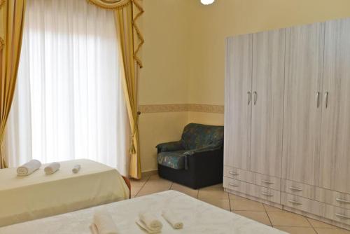 Postel nebo postele na pokoji v ubytování Sea View House, Riposto