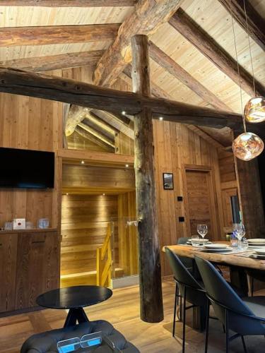 a room with a table and chairs in a building at Ad Maiora Baita Walser with SPA in Alagna Valsesia