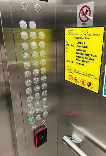 a vending machine with a yellow sign on it at Formosa Residence Nagoya, 2 Bedroom, Batam City in Nagoya