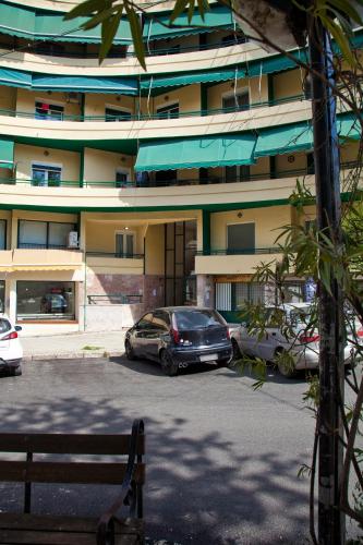 a car parked in a parking lot in front of a building at Casa Reale Ioannina in Ioannina