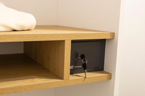 a small tv on a wooden shelf in a room at Quattro Canti in Carini
