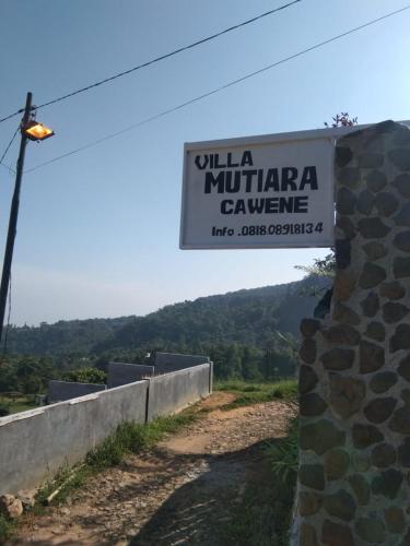 a sign for a university of muncie cavensicsnsics at Villa Mutiara Cawene in Gunungpicung