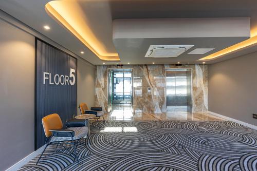 a meeting room with a carpet on the wall at Coastlands Skye Hotel, Ridgeside, Umhlanga in Durban