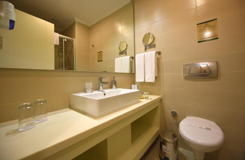 a bathroom with a sink and a toilet at Side Star Beach Hotel - Ultra All Inclusive in Side