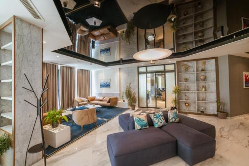 a living room with a couch and a table at Hotel Imperial Conference & Spa in Budva