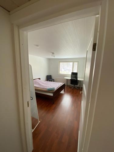 a room with a bed and a room with a window at Big Duplex, 15min to Turku or Naantali in Turku