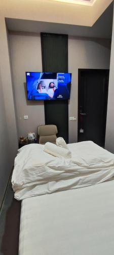 Hotel Tajikgrey Dushanbeにあるベッド