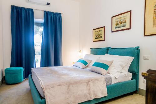 Ένα ή περισσότερα κρεβάτια σε δωμάτιο στο Casale Lorenzo Appartamenti