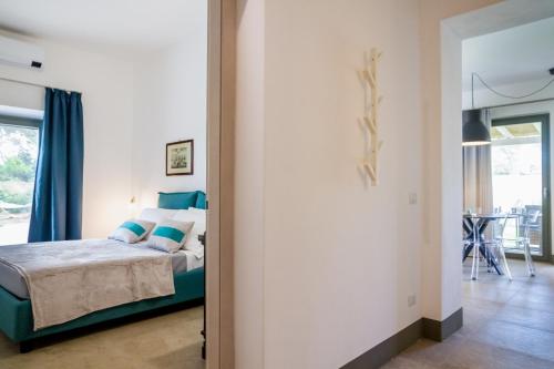 Ένα ή περισσότερα κρεβάτια σε δωμάτιο στο Casale Lorenzo Appartamenti