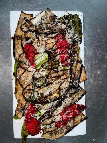 a plate of food on a table at Hotel Aroma in Përmet