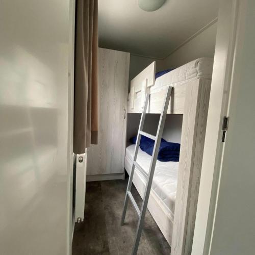 a small room with a bunk bed in it at Nature Cabin 5 p. in Zuna